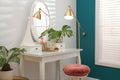 Dressing table with mirror in room interior Royalty Free Stock Photo