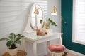 Dressing table with mirror in room interior Royalty Free Stock Photo