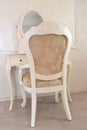 Dressing table and white chair in a hotel room Royalty Free Stock Photo