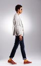 Dressing well is a form of good manners. Studio shot of a fashionable young man against a gray background.