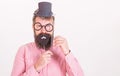Dressing well makes you seem more intelligent. Tricks to seem more intelligent. Man bearded hipster cardboard top hat