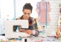 Dressmaker woman working with sewing machine