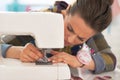 Dressmaker woman working with sewing machine