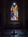 Dreux, France, April 30, 2019: artistic glass windows and baptismal font in Chapel Royal Saint Louis