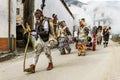 Slovene traditional carnival masks `Ta grdi` running after the teenager and throwing the ash at him