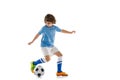 Portrait of preschool boy, football soccer player in action, motion training isolated on white studio background Royalty Free Stock Photo