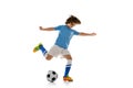 Portrait of preschool boy, football soccer player in action, motion training isolated on white studio background Royalty Free Stock Photo