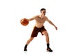 Dribbling. Dynamic footage of professional basketball player training with basketball ball isolated over white