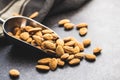 Dried almond nuts in metal scoop Royalty Free Stock Photo