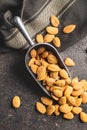 Dried almond nuts in metal scoop Royalty Free Stock Photo