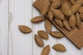 Dried almonds spilled out on a gray background. healthy food for raw foodists and vegetarians. Royalty Free Stock Photo