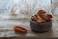 Dried Apple slices in a ceramic sauce pan on a wooden surface Royalty Free Stock Photo