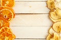 Dried apples and oranges on wooden background. top view Royalty Free Stock Photo