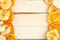 Dried apples and oranges on wooden background. top view Royalty Free Stock Photo