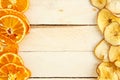 Dried apples and oranges on wooden background. top view Royalty Free Stock Photo