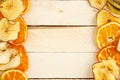 Dried apples and oranges on wooden background. top view Royalty Free Stock Photo