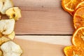 Dried apples and oranges on wooden background. top view Royalty Free Stock Photo