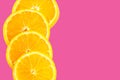 Orange slice isolated on pink background. fresh fruit. top view Royalty Free Stock Photo