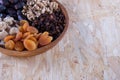 Dried apricot, nuts, faygi, dates and raisins in a wooden cup Royalty Free Stock Photo