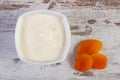 Dried apricot and yogurt in bowl, increase metabolism