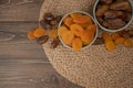 Dried apricots and dates fruits on dark wood background with copy space. Royalty Free Stock Photo