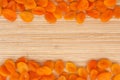 Dried apricots lying on a bamboo mat