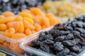 Dried apricots and raisins sultanas at the market. Naturally Dried apricots color orange. Dried apricots in the background. Mix