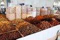 Dried apricots and various nuts in bags and boxes at the Chorsu market in Tashkent, Uzbekistan