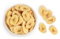 Dried banana chips in ceramic bowl isolated on white background with full depth of field. Top view. Flat lay Royalty Free Stock Photo