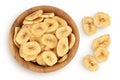 Dried banana chips in wooden bowl isolated on white background with full depth of field. Top view. Flat lay Royalty Free Stock Photo