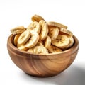 dried banana sliced in bowl on white background