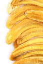 Dried banana slices. Sliced dried banana isolated on white background. Sun-dried fruit. close up Royalty Free Stock Photo