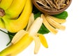 Dried bananas in the bowl and fresh bananas isolated on white background. Sticks of dehydrated banana pulp Royalty Free Stock Photo