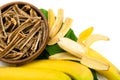 Dried bananas in the bowl and fresh bananas isolated on white background. Sticks of dehydrated banana pulp Royalty Free Stock Photo