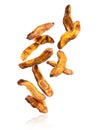 Dried bananas falling down on a white background Royalty Free Stock Photo