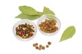 Dried bay leaf, glass containers with pepper and allspice Royalty Free Stock Photo