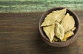 Aromatic laurel leaves - Laurus nobilis. Wood background Royalty Free Stock Photo