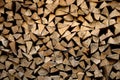 Dried beech wood ready for heating. Wooden pile in a stack. Triangular shape. Chopped firewood logs dried on a pile. Royalty Free Stock Photo