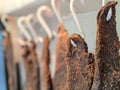 Dried beef meat biltong hanging on hooks