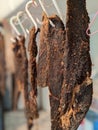 Dried beef meat jerky biltong hanging on hooks