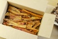 A dried beef tendon in a cardboard box Royalty Free Stock Photo