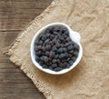 Dried black chickpea on a wooden table