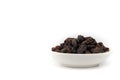 Dried black raisin in white bowl isolated in white background Royalty Free Stock Photo