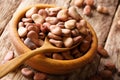 Dried broad beans close-up in a wooden bowl. horizontal