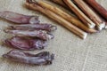 Dried bully sticks and rabbit ears on burlap