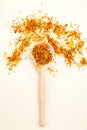 Dried calendula herbs and wooden spoon. Healthy lifestyle. Vertical photo Royalty Free Stock Photo