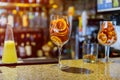 Dried candied orange wheels in large glass container