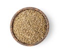 Dried caraway seeds in wood bowl on white background. top view