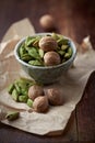 Dried cardamon pods and nutmeg in a dish