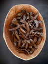 Dried carob pods close-up in a cork container.Isolated carob and carob Royalty Free Stock Photo